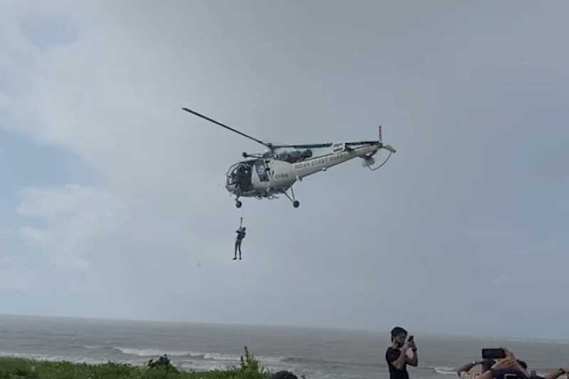 An Indian Coast Guard helicopter on Friday morning rescues a crewman of a minibarge which broke from its mooring and hut the rocks off Palghar coast, sparking a huge security scare on Thursday.