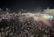 Public switch on mobile phone torch lights to show support for Owaisi;