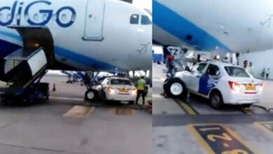 Car stops under parked IndiGo aircraft at Delhi airport