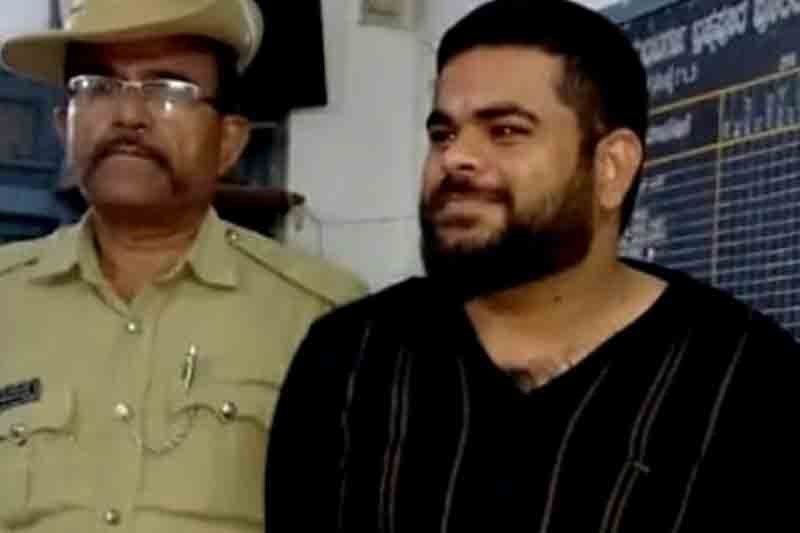 K'taka BJP leader arrested briefly over 'ready to shoot you' remark