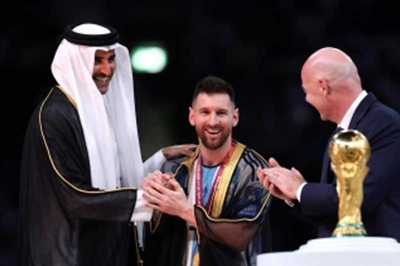 Emir of Qatar placing a robe on Messi at presentation ceremony creates a storm of anger