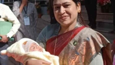 Cuddling baby in arms, NCP MLA attends Maha Legislature
