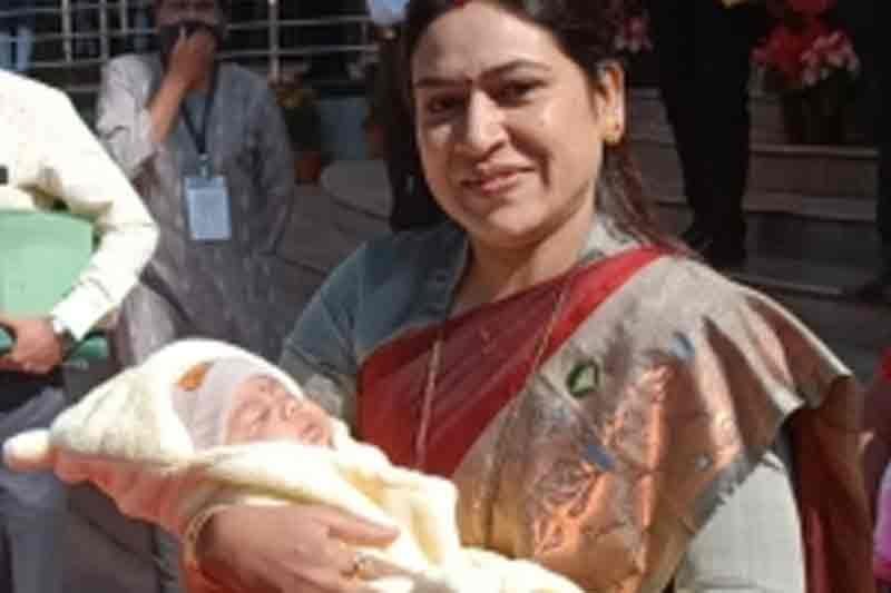 Cuddling baby in arms, NCP MLA attends Maha Legislature