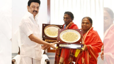Stalin felicitates elephant whisperers Bomman and Bellie