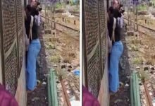 Shocking Video of Woman Risking Life Hanging onto Moving Mumbai Local Train