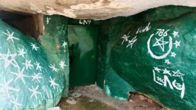 Painting boulders with Islamic symbols in K'taka, one held
