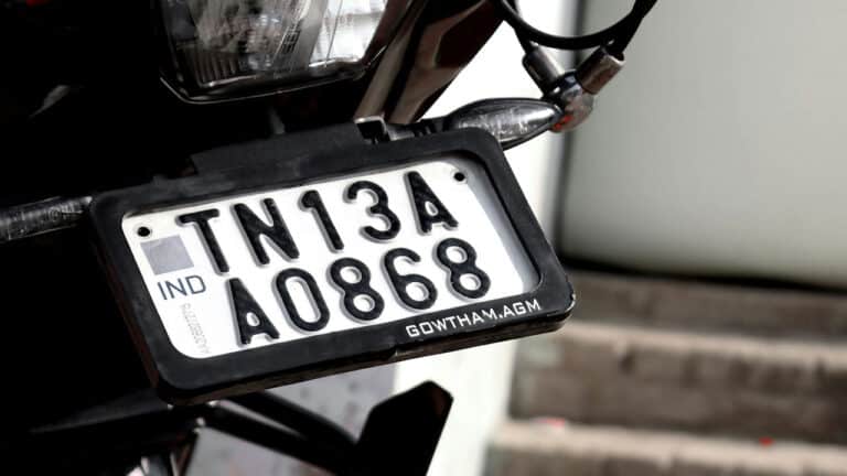 HSRP plates feature laser-etched codes, Ashok Chakra holograms, and snap-lock rivets for tamper-proof security.