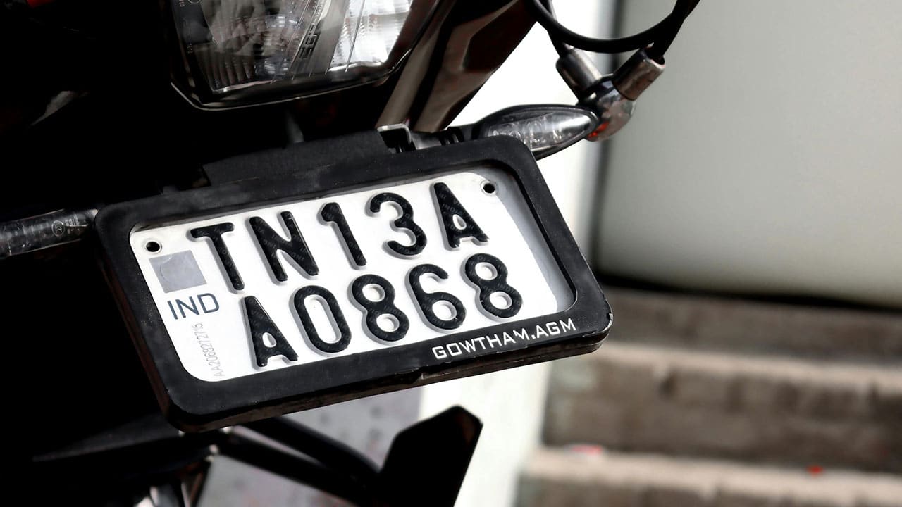 HSRP plates feature laser-etched codes, Ashok Chakra holograms, and snap-lock rivets for tamper-proof security.