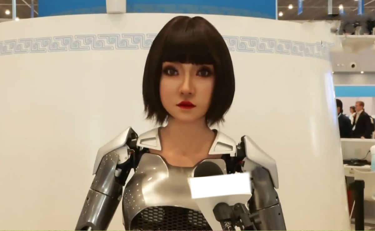 Xiao He, the humanoid AI robot, assisting a journalist at the SCO Summit 2025 in Tianjin.
