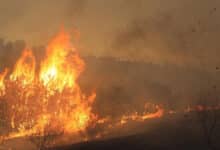 Thousands under evacuation orders as fast-moving wildfire rages in Southern California