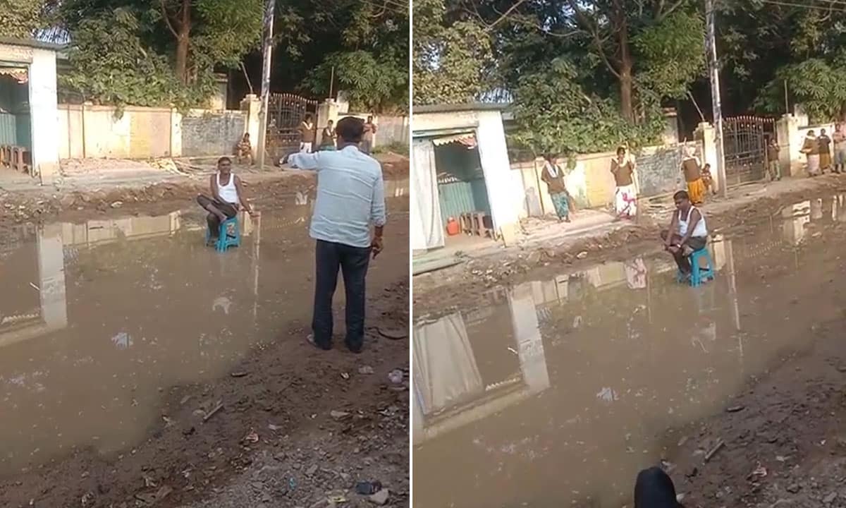 Salon Owner Blocks Waterlogged Road, Protests Slow Repairs Affecting His Business