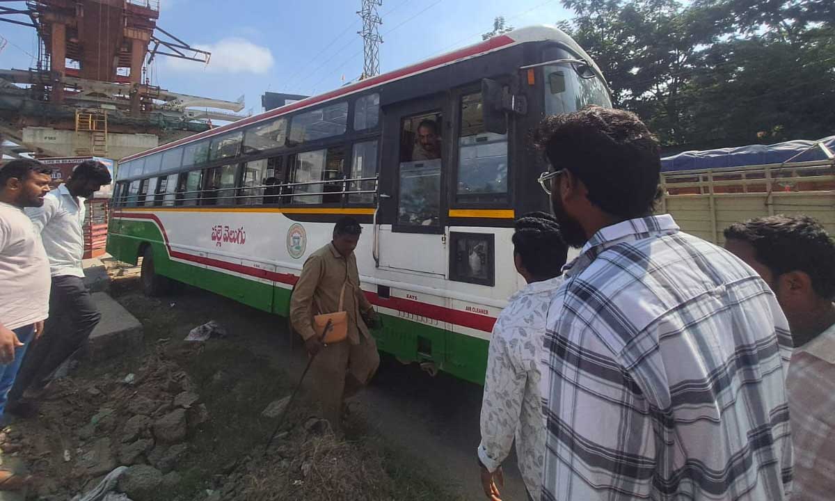 RTC Bus Loses Control Near Medipally; Major Mishap Averted at Elevated Flyover Corridor