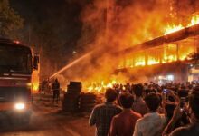 Firefighters battle the huge fire at Anu Furniture Shop Chandanagar Hyderabad as massive flames engulf the building while a large crowd gathers nearby to watch the dramatic scene on March 13, 2026.