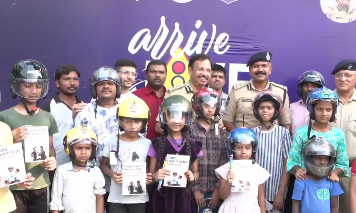 Hyderabad Road Safety Drive: CP V.C. Sajjanar Leads ‘Arrive Alive’ Program, Helmets Distributed to Children